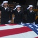 Sailors participate in a burial-at-sea