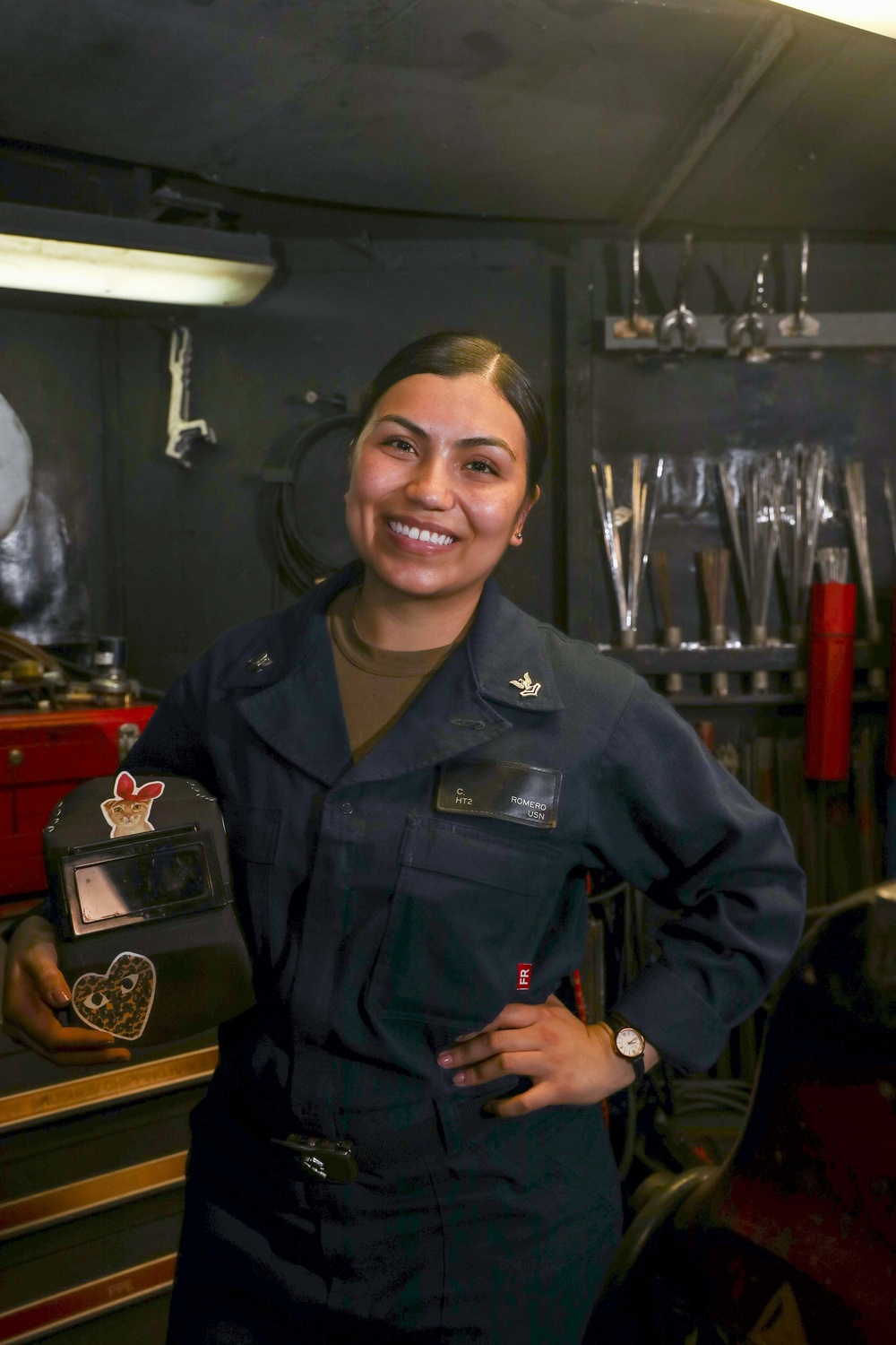 Hull Technician Clarissa Romero poses for a photo aboard the aircraft carrier USS Abraham Lincoln (CVN 72).