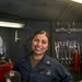 Hull Technician Clarissa Romero poses for a photo aboard the aircraft carrier USS Abraham Lincoln (CVN 72).