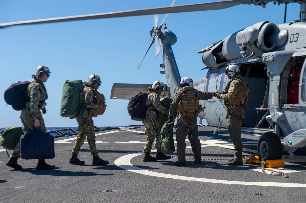 Barry Sailors Conduct Personnel Transfer During Flight Quarters