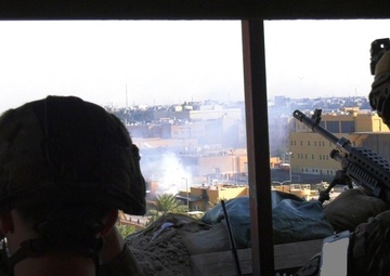 Soldiers Monitor U.S. Embassy in Iraq