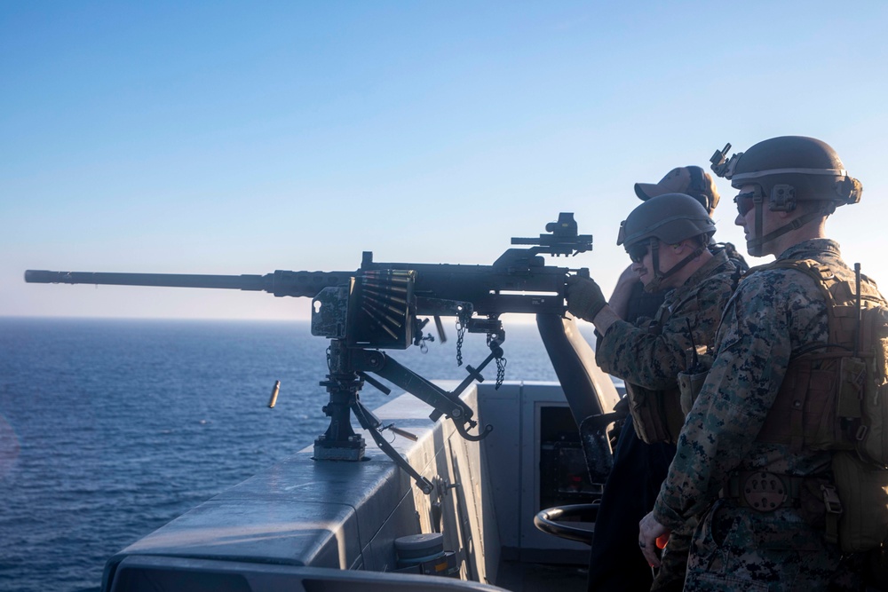 Marine fires machine gun