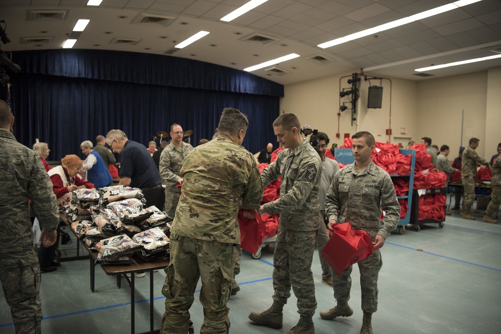 128th Air Refueling Wing members take time out of their day to visit the Milwaukee VA Hospital and deliver presents to veterans that will be hospitalized over the holidays. (U.S. Air National Guard photo by Master Sgt. Kellen Kroening/Released)