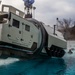 Assault Amphibian School students take a ride in the Submerged Vehicle Egress Trainer