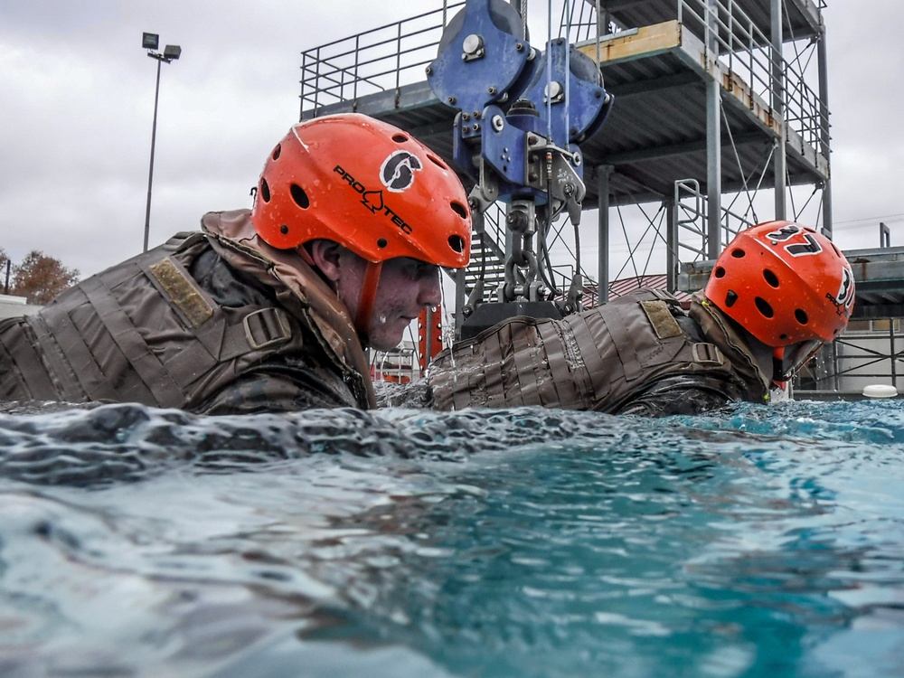 Assault Amphibian School students take a ride in the Submerged Vehicle Egress Trainer