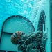 Assault Amphibian School students take a ride in the Submerged Vehicle Egress Trainer