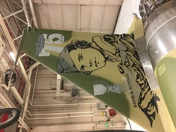 Local artist adds finishing touches to new wing flagship