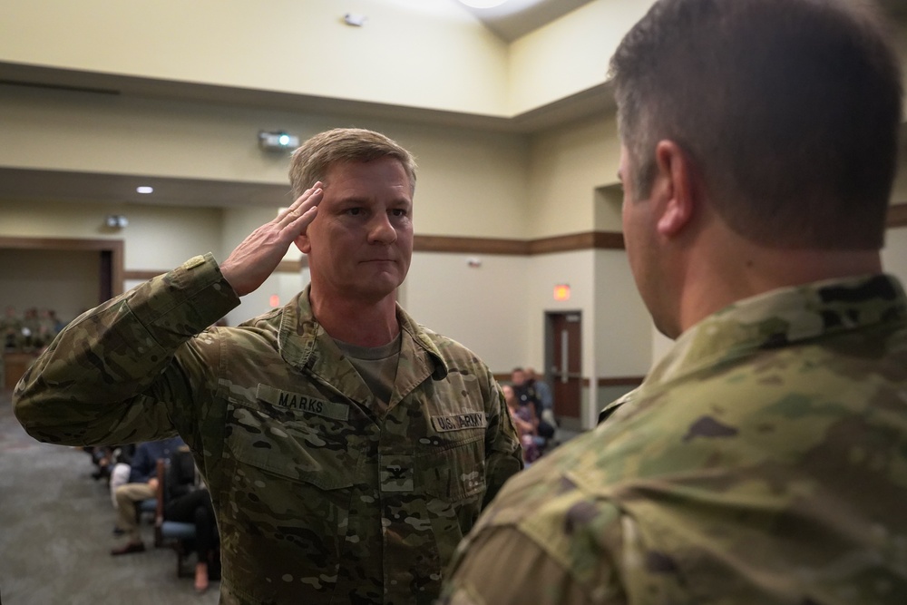 Col. Steven M. Marks, deputy commander, 1st Special Forces Command (Airborne) awards a Soldier from 2nd Battalion, 7th Special Forces Group (Airborne)