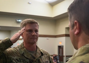 Col. Steven M. Marks, deputy commander, 1st Special Forces Command (Airborne) awards a Soldier from 2nd Battalion, 7th Special Forces Group (Airborne)