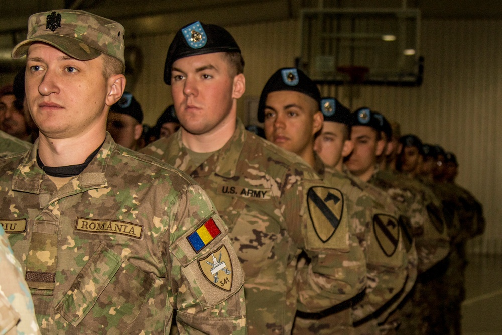 Soldiers of Able Company, 1-5 Cavalry, 2nd ABCT, 1st Cavalry Division along with Romanian soldiers conduct a change of command ceremony