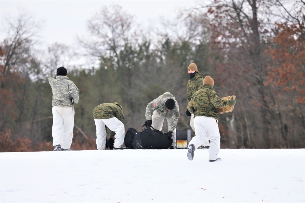 Cold-Weather Operations Course Class 20-01 students build Arctic tents during training at Fort McCoy