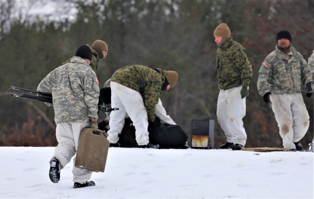 Cold-Weather Operations Course Class 20-01 students build Arctic tents during training at Fort McCoy