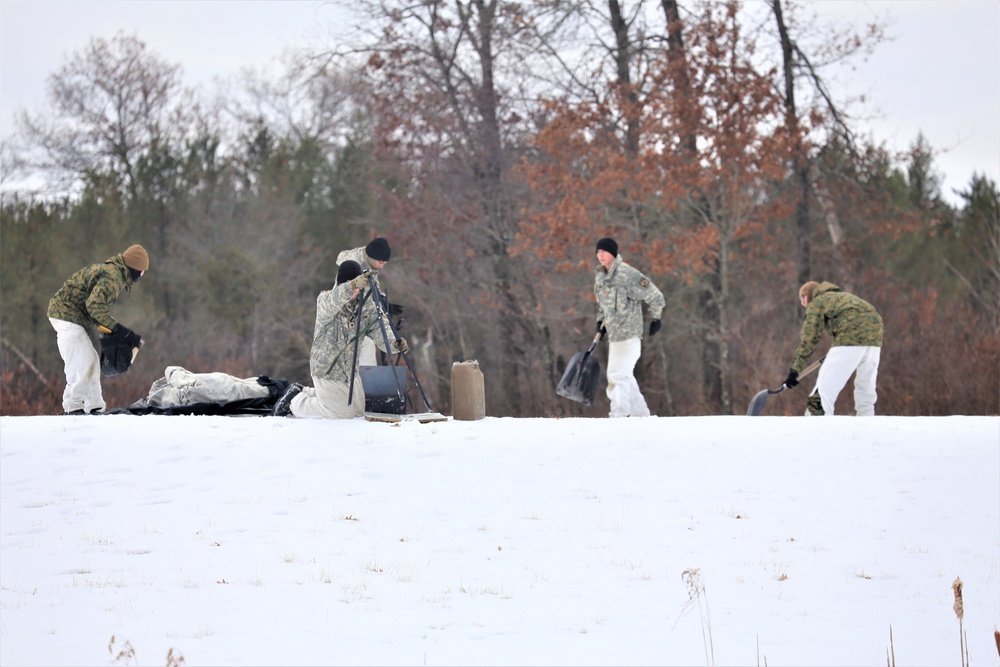 Cold-Weather Operations Course Class 20-01 students build Arctic tents during training at Fort McCoy