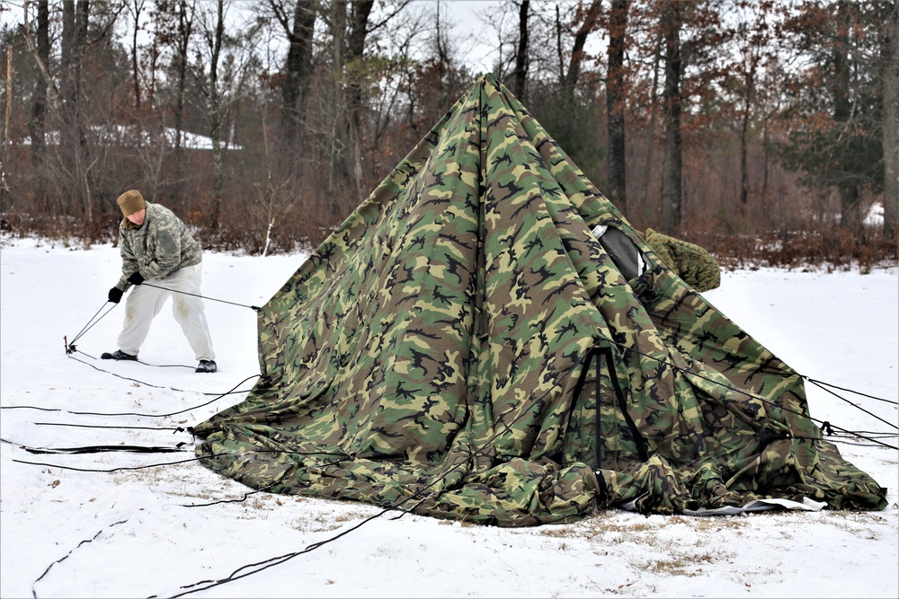 Cold-Weather Operations Course Class 20-01 students build Arctic tents during training at Fort McCoy