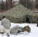 Cold-Weather Operations Course Class 20-01 students build Arctic tents during training at Fort McCoy