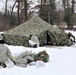 Cold-Weather Operations Course Class 20-01 students build Arctic tents during training at Fort McCoy
