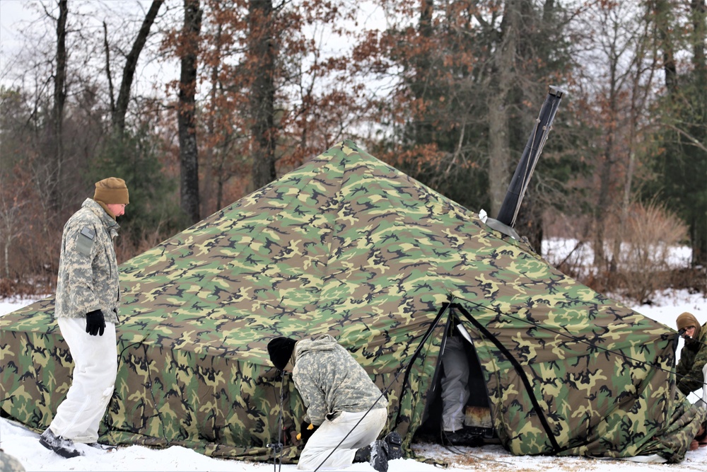 Cold-Weather Operations Course Class 20-01 students build Arctic tents during training at Fort McCoy