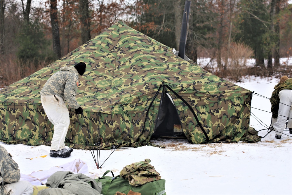 Cold-Weather Operations Course Class 20-01 students build Arctic tents during training at Fort McCoy
