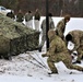 Cold-Weather Operations Course Class 20-01 students build Arctic tents during training at Fort McCoy
