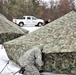 Cold-Weather Operations Course Class 20-01 students build Arctic tents during training at Fort McCoy