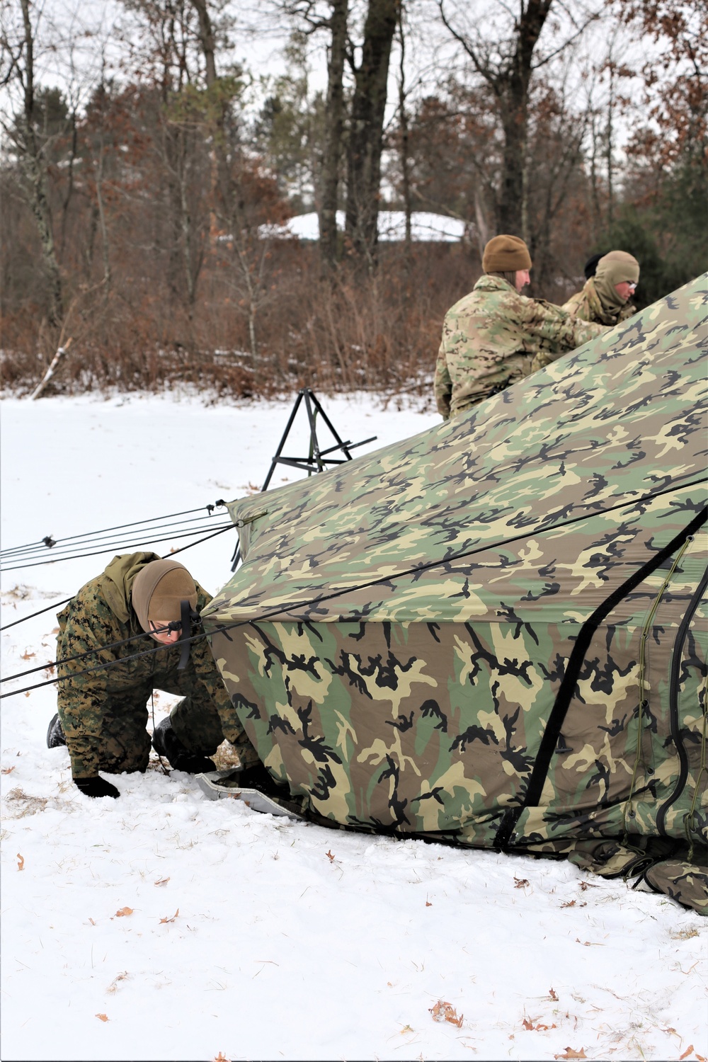 Cold-Weather Operations Course Class 20-01 students build Arctic tents during training at Fort McCoy
