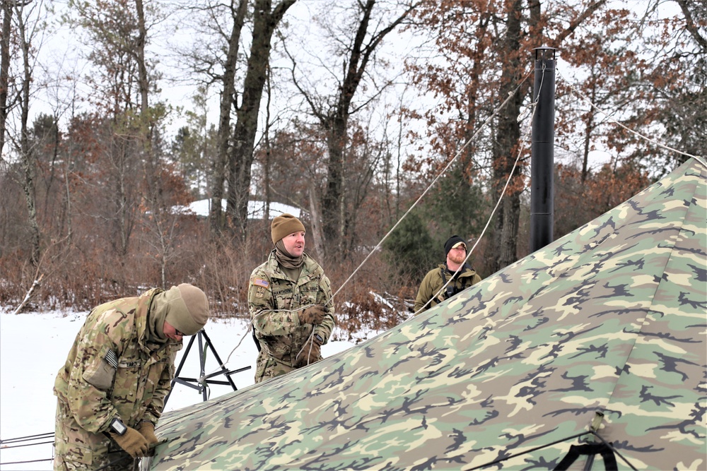 Cold-Weather Operations Course Class 20-01 students build Arctic tents during training at Fort McCoy