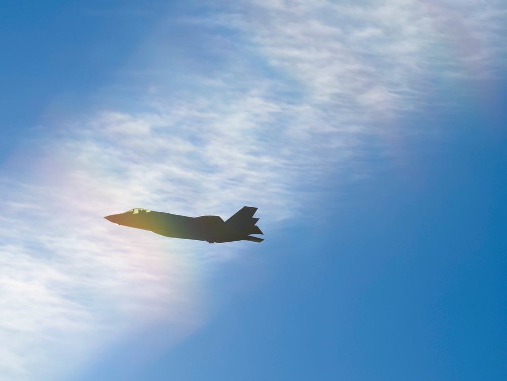 F-35s and F-16s soar in the morning sky