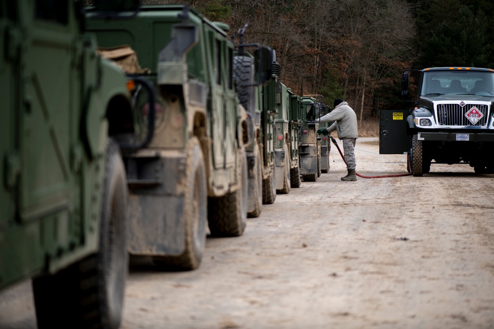 Airman Refuels HUMVEEs for Departure