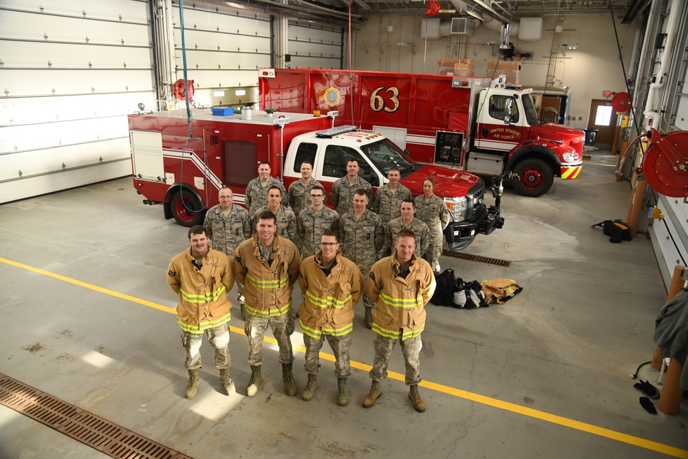 148th FW Firefighters Pose with newly acquired P-26 Water Tender