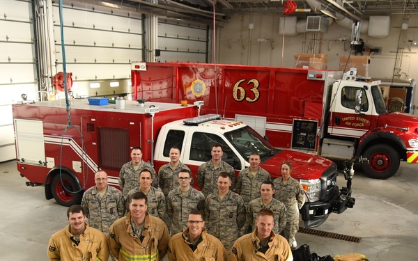 148th FW Firefighters Pose with newly acquired P-26 Water Tender