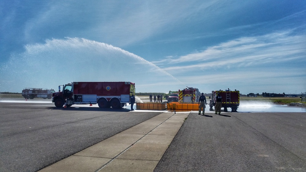 148th FW Firefighters Pose with newly acquired P-26 Water Tender