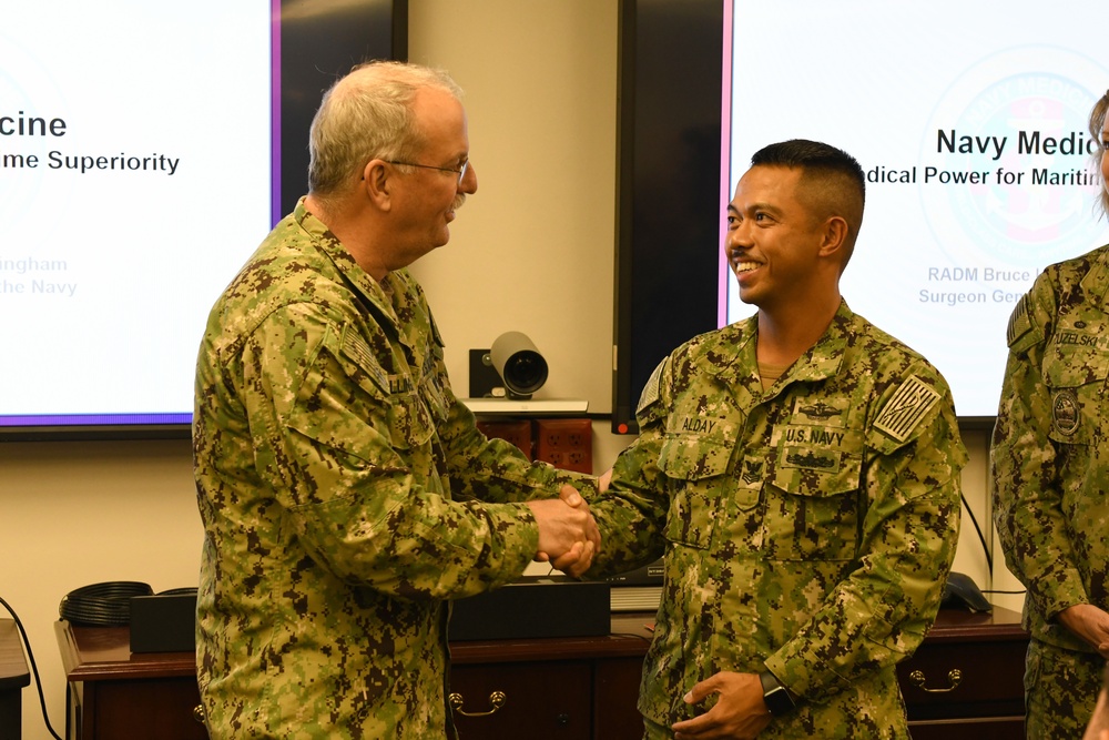 Rear Adm. Bruce Gillingham, Navy Surgeon General, recognizes Sailors during his visit to Naval Medical Readiness Training Command Pearl Harbor