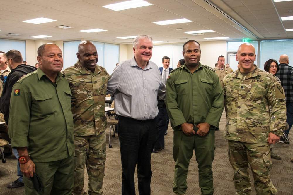 Nevada Governor Steve Sisolak and Adjutant General Ondra Berry pose for a photo with members of the Fijian military