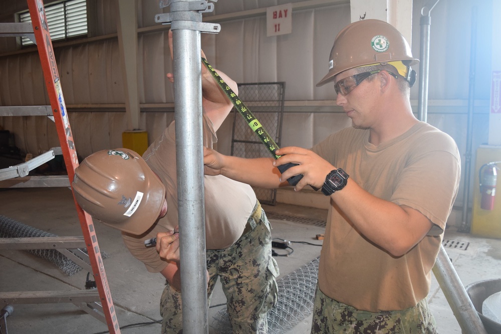 U.S. Navy Seabees from NMCB 5’s Detail Diego Garcia conduct high quality construction