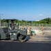 U.S. Navy Seabees with NMCB-5 lay asphalt on board Marine Corps Air Station Futenma