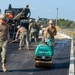 U.S. Navy Seabees with NMCB-5 lay asphalt on board Marine Corps Air Station Futenma