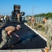 U.S. Navy Seabees with NMCB-5 lay asphalt on board Marine Corps Air Station Futenma