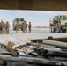 Soldiers, Airmen and contractors clearing debris after Al-Asad Airbase missile attack