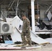 Soldiers, Airmen and contractors clearing debris after Al-Asad Airbase missile attack