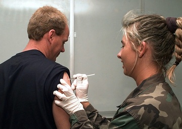Airmen receives shot in preparation for Operation Allied Force