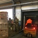 Staff Sgt. Abigail Lopez and Sgt. Dominique Williams, Food Inspectors at Veterinary Branch Kaiserslautern, unloading freight from a truck.