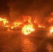 Coast Guard rescues 3 people from burning vessel