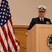 Cmdr. Michael Vaas speaks during a change-of-charge ceremony aboard NSA Philadelphia.