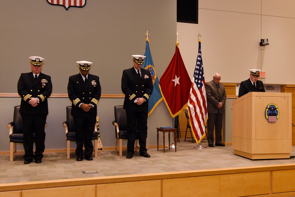 Chaplain Michael Sparrow delivers the benediction during a change-of-charge ceremony aboard NSA Philadelphia.