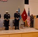 Chaplain Michael Sparrow delivers the benediction during a change-of-charge ceremony aboard NSA Philadelphia.