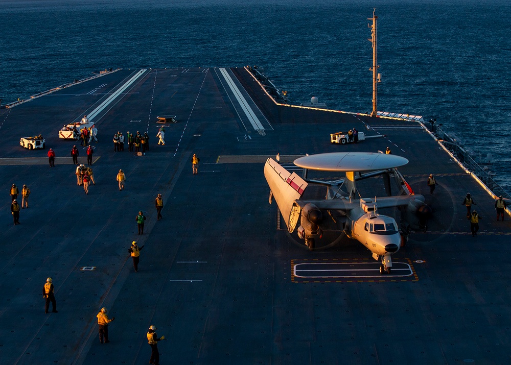 Sailors work on flight deck