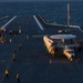 Sailors work on flight deck