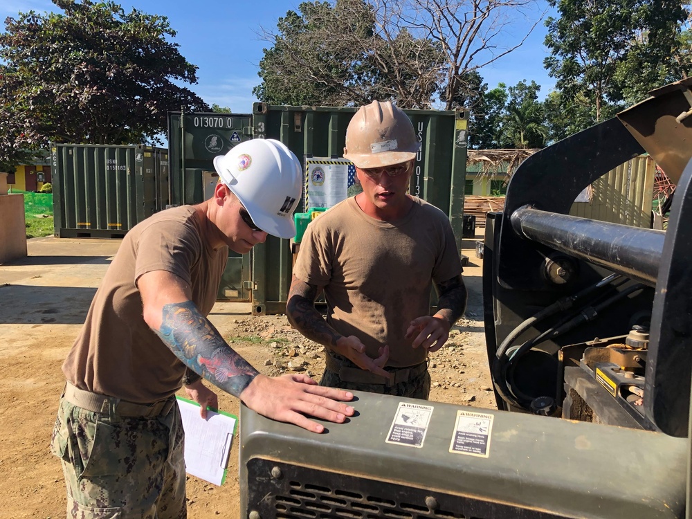 U.S. Navy Seabees deployed with NMCB-5’s Detail Palawan continue construction on Malatgao Elementary School