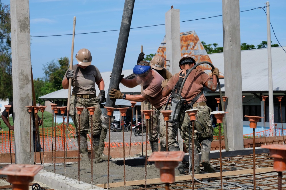 U.S. Navy Seabees deployed with NMCB-5’s Detail Timor-Leste build a three-room schoolhouse in Liquica, Timor-Leste