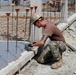 U.S. Navy Seabees deployed with NMCB-5’s Detail Timor-Leste build a three-room schoolhouse in Liquica, Timor-Leste